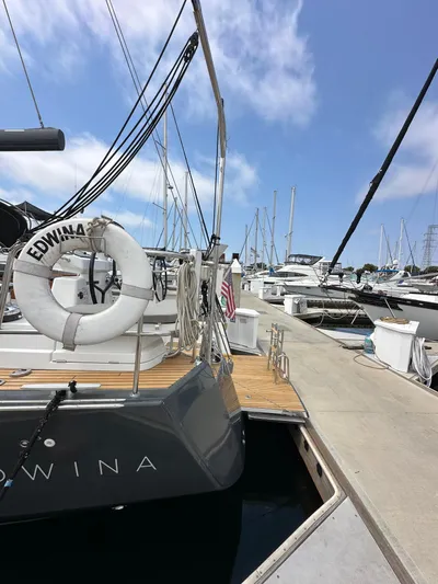Edwina Yacht Photos Pics Jeanneau 54 yacht docked at marina, 2018 model, with clear blue sky.