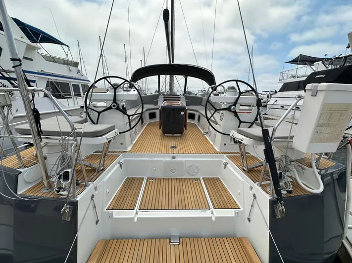 Edwina Yacht Photos Pics 2018 Jeanneau 54 yacht cockpit with dual steering wheels and teak decking.
