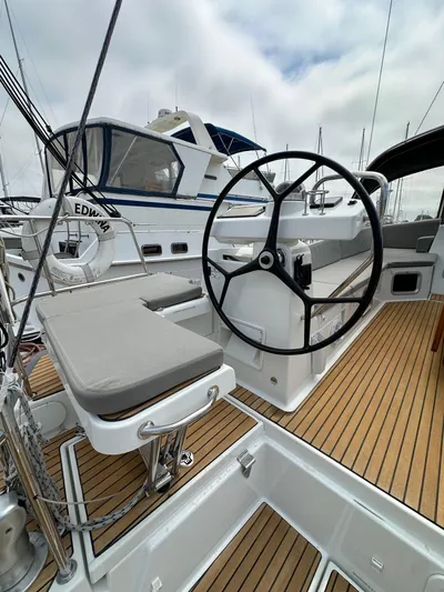 Edwina Yacht Photos Pics 2018 Jeanneau 54 yacht cockpit with steering wheel and teak flooring.