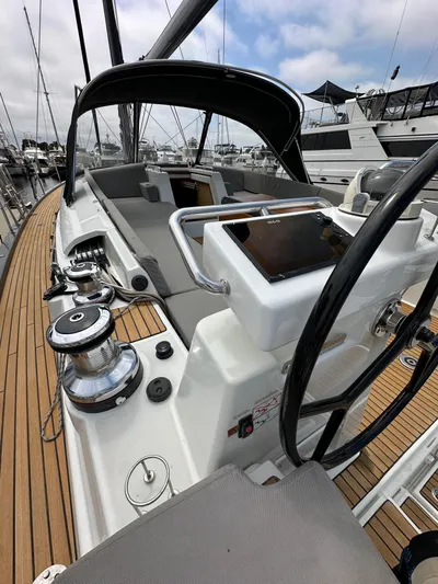 Edwina Yacht Photos Pics Cockpit of 2018 Jeanneau 54 sailboat with steering wheel and navigation equipment.