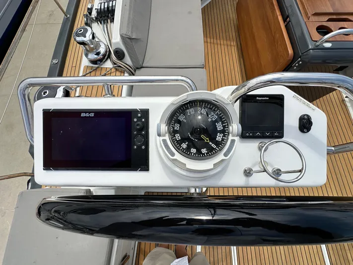 Edwina Yacht Photos Pics Helm of 2018 Jeanneau 54 yacht with navigation instruments and compass.