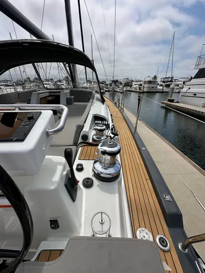 Edwina Yacht Photos Pics 2018 Jeanneau 54 yacht docked at marina, showcasing sleek deck and modern design.