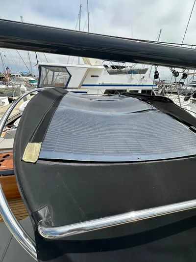 Edwina Yacht Photos Pics 2018 Jeanneau 54 yacht with solar panel on deck, docked at marina.