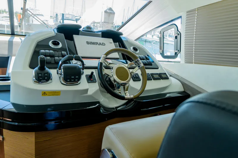Gracia Yacht Photos Pics 2019 Beneteau Gran Turismo 50 helm with advanced navigation controls and steering wheel.