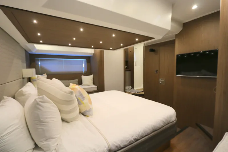 Gracia Yacht Photos Pics Luxurious bedroom interior of 2019 Beneteau Gran Turismo 50 yacht with modern amenities.