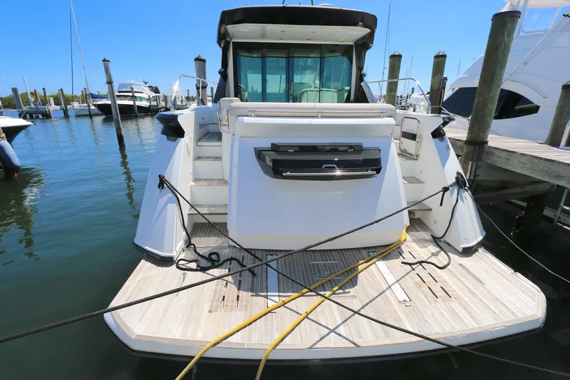Gracia Yacht Photos Pics 2019 Beneteau Gran Turismo 50 yacht docked at marina, rear view.