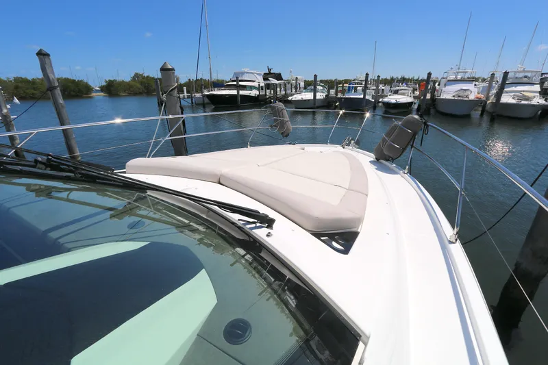 Gracia Yacht Photos Pics 2019 Beneteau Gran Turismo 50 yacht docked at a marina under clear blue skies.