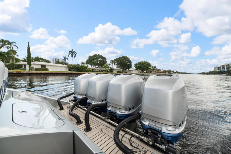  Yacht Photos Pics 2017 Midnight Express 43 Open boat with four powerful outboard engines on a scenic waterway.