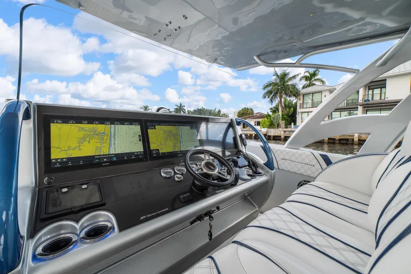  Yacht Photos Pics 2017 Midnight Express 43 Open boat cockpit with advanced navigation screens and luxurious seating.