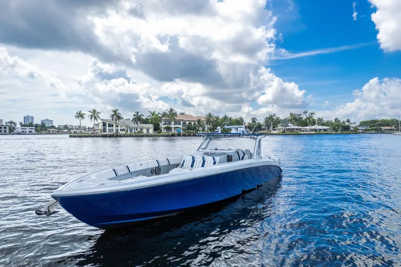  Yacht Photos Pics 2017 Midnight Express 43 Open boat on calm water under a partly cloudy sky.