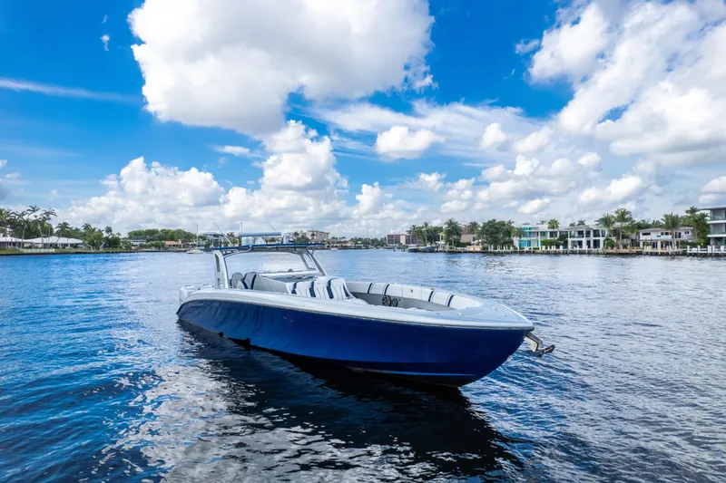  Yacht Photos Pics 2017 Midnight Express 43 Open boat on calm water under a vibrant blue sky.