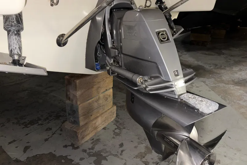  Yacht Photos Pics 2020 Chris-Craft Launch 28 GT boat engine on wooden blocks in a garage.