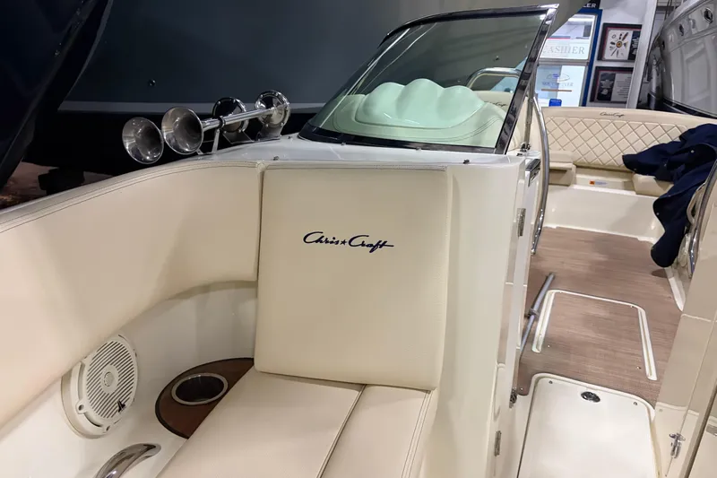  Yacht Photos Pics 2020 Chris-Craft Launch 28 GT interior with cream upholstery and wood accents.