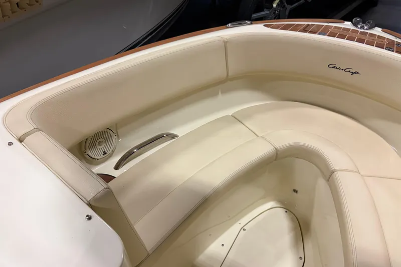 Yacht Photos Pics 2020 Chris-Craft Launch 28 GT boat interior with cream leather seating and speaker.