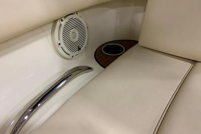  Yacht Photos Pics 2020 Chris-Craft Launch 28 GT interior with speaker, cup holder, and handrail.