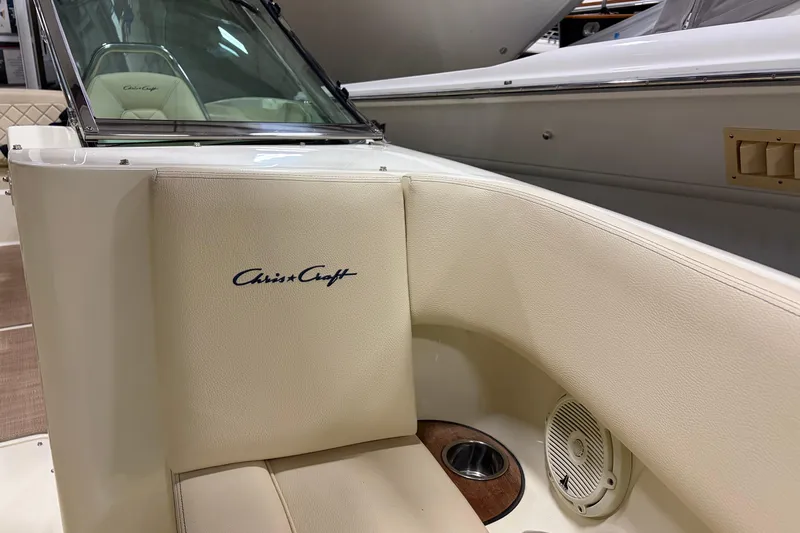  Yacht Photos Pics 2020 Chris-Craft Launch 28 GT boat interior with logo, beige seating, and speaker.