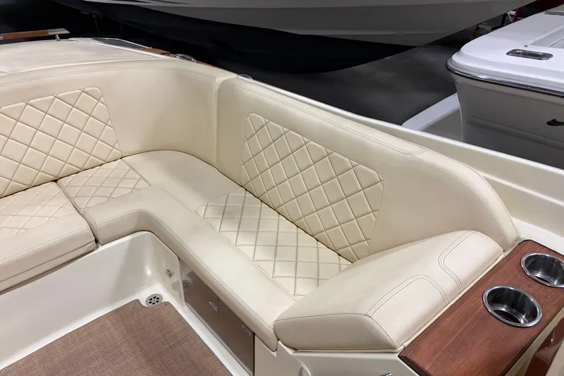  Yacht Photos Pics Luxurious seating on 2020 Chris-Craft Launch 28 GT boat with quilted upholstery and cup holders.