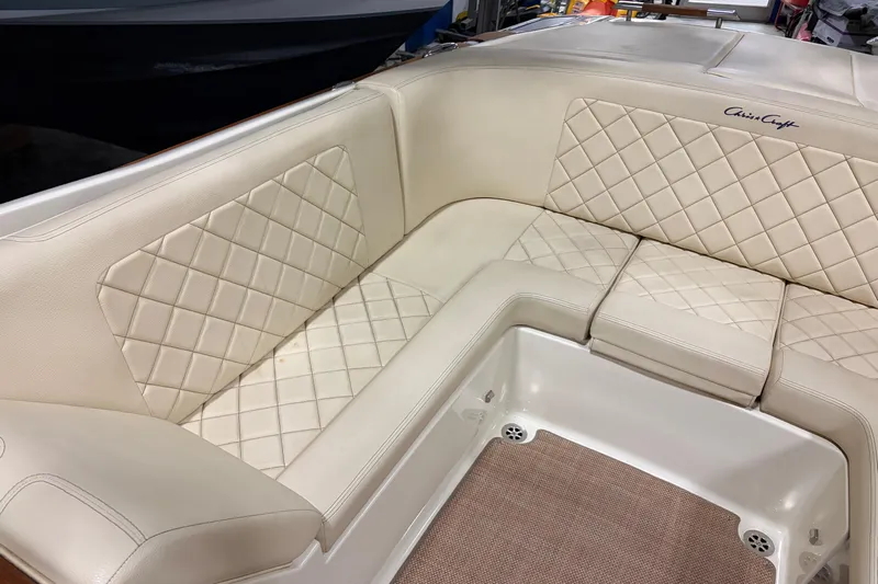  Yacht Photos Pics 2020 Chris-Craft Launch 28 GT boat interior with beige quilted seating.