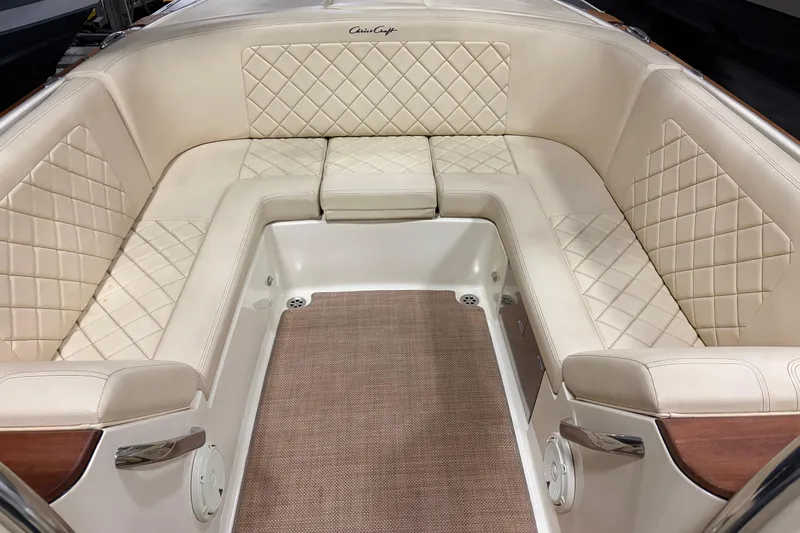  Yacht Photos Pics Luxurious interior of 2020 Chris-Craft Launch 28 GT with beige diamond-stitched seating.