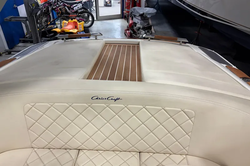  Yacht Photos Pics 2020 Chris-Craft Launch 28 GT boat interior with quilted leather seating and wood accents.