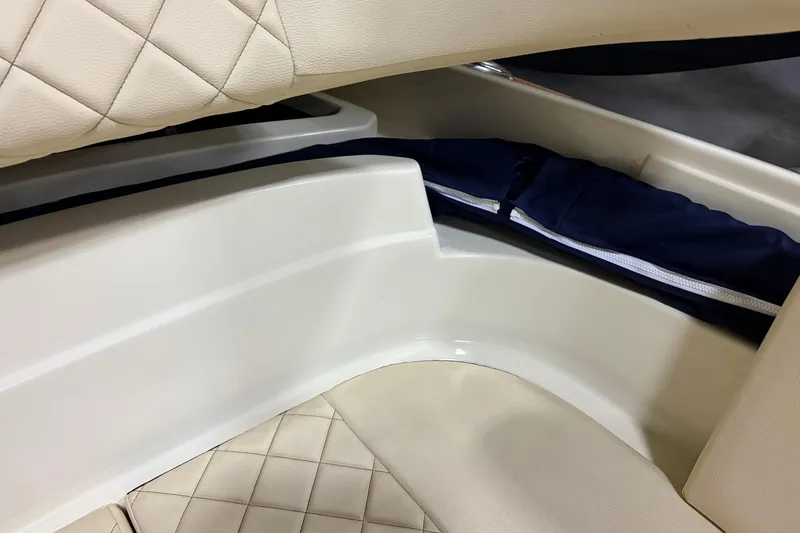  Yacht Photos Pics 2020 Chris-Craft Launch 28 GT interior with quilted seating and storage compartment.