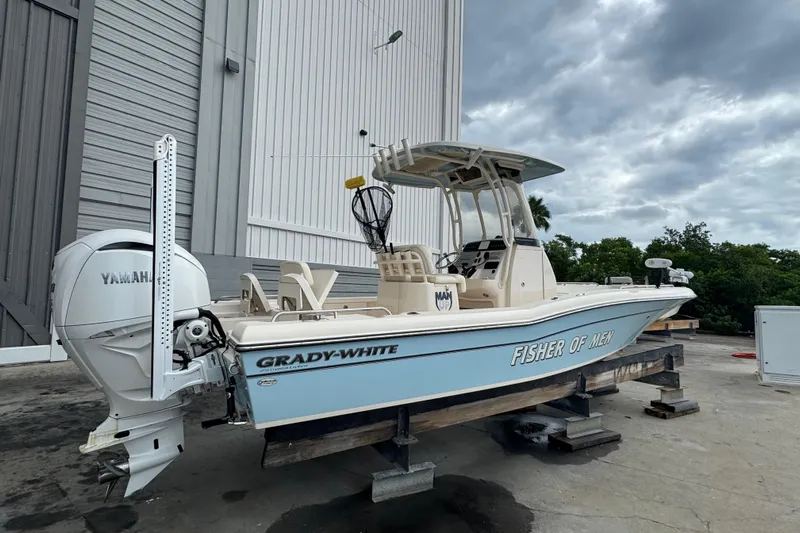  Yacht Photos Pics 2023 Grady-White 251 Coastal Explorer boat with Yamaha engine, docked outdoors.