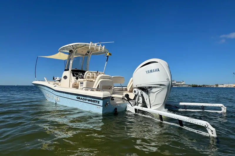  Yacht Photos Pics 2023 Grady-White 251 Coastal Explorer boat with Yamaha engine on calm water.