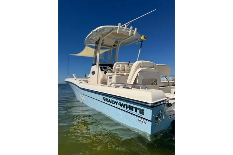  Yacht Photos Pics 2023 Grady-White 251 Coastal Explorer boat on water, clear blue sky background.