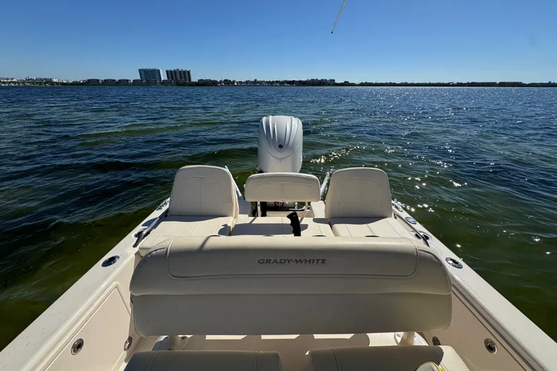  Yacht Photos Pics 2023 Grady-White 251 Coastal Explorer boat on open water, sunny day.