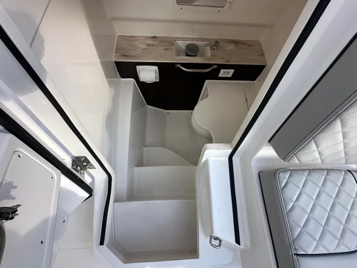 Yacht Photos Pics Interior of 2023 Pursuit 288 S with sink and seating.