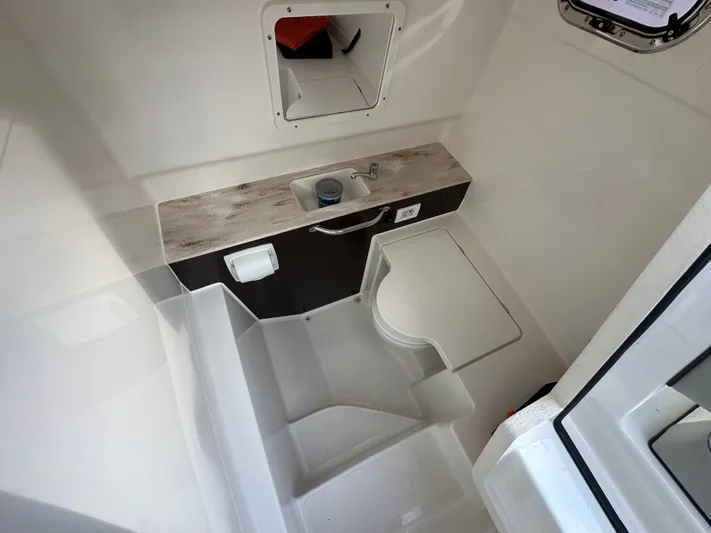  Yacht Photos Pics Interior of 2023 Pursuit 288 S with sink and toilet.