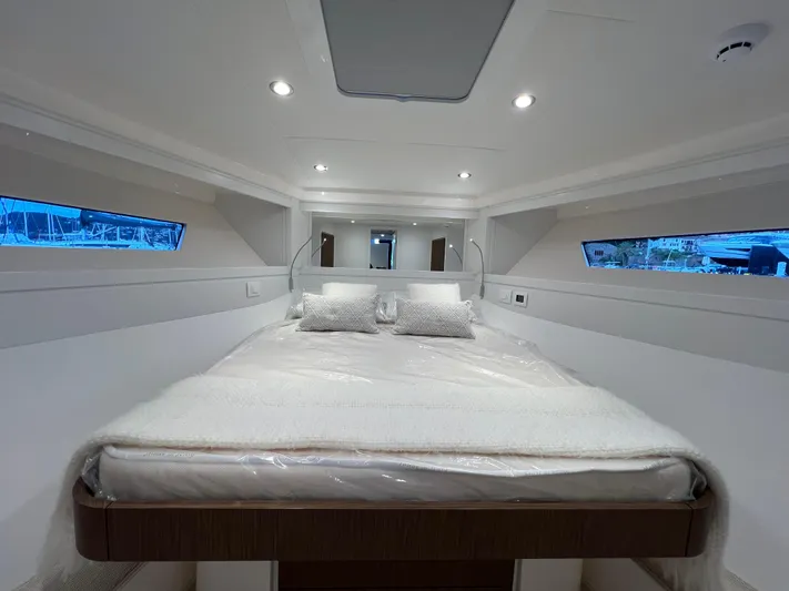 Stanislas Michel Yacht Photos Pics Luxurious interior cabin of 2025 Itama 45 RS yacht with modern design and comfortable bedding.