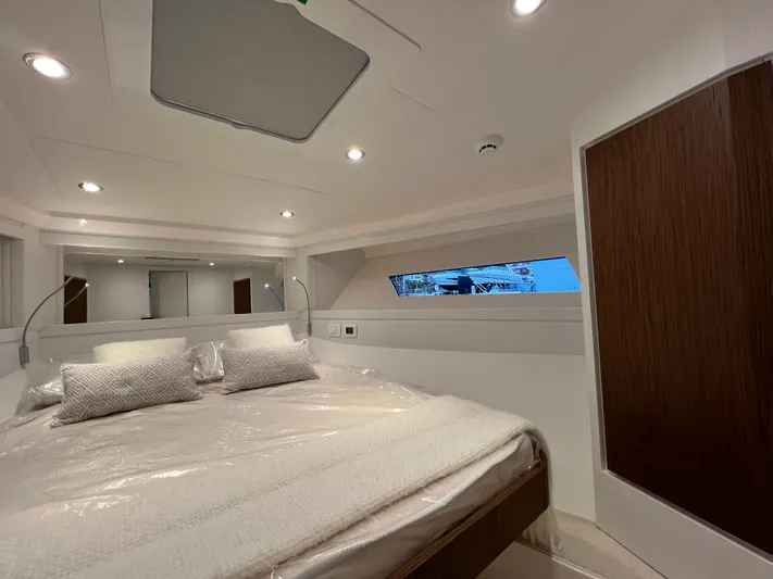 Stanislas Michel Yacht Photos Pics Luxurious cabin interior of 2025 Itama 45 RS yacht with modern design and cozy bedding.