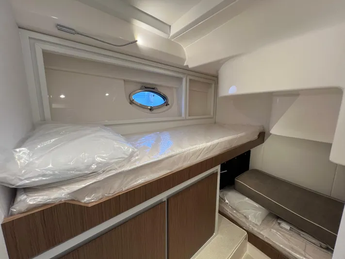 Stanislas Michel Yacht Photos Pics 2025 Itama 45 RS yacht interior cabin with modern design and compact sleeping area.