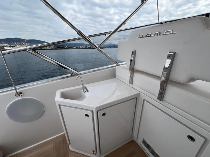 Stanislas Michel Yacht Photos Pics Luxury Itama 45 RS yacht interior with sleek white cabinetry and ocean view, 2025 model.