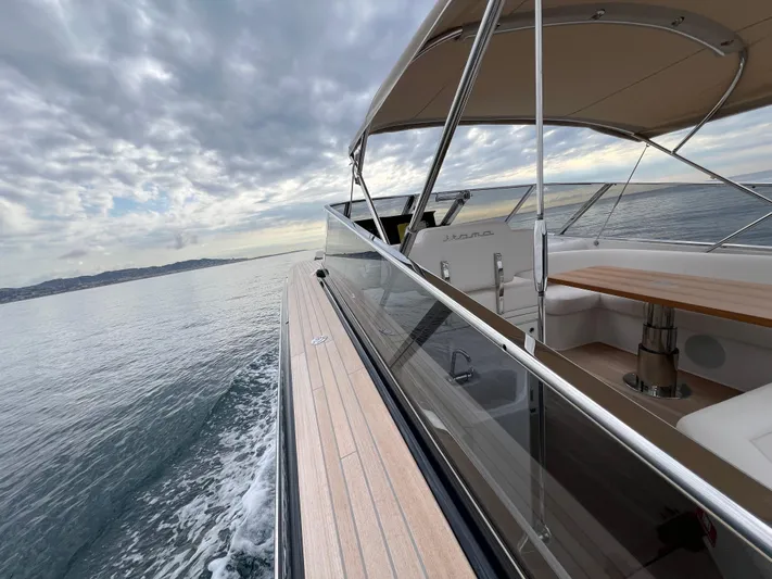 Stanislas Michel Yacht Photos Pics 2025 Itama 45 RS yacht cruising on calm waters under a cloudy sky.