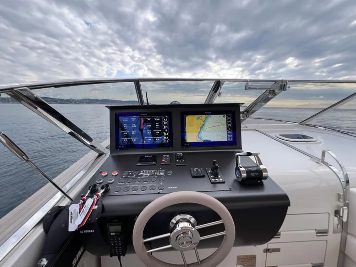 Stanislas Michel Yacht Photos Pics Helm of 2025 Itama 45 RS yacht with navigation screens and steering wheel.