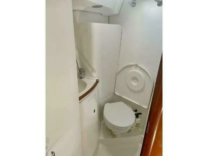  Yacht Photos Pics Compact bathroom in a 2007 Beneteau 423 yacht, featuring a toilet and sink.