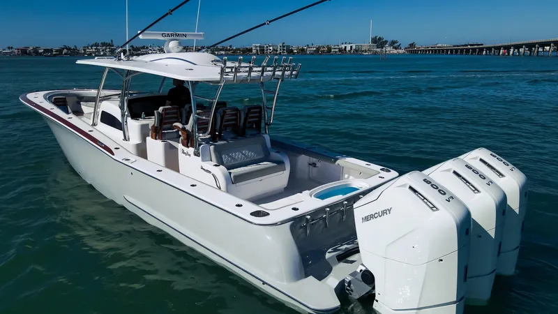  Yacht Photos Pics 2026 Mag Bay 43 CC boat with triple Mercury engines on the water.