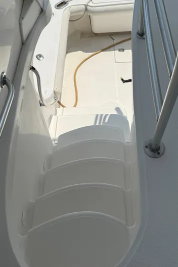 Yacht Photos Pics 2004 Luhrs 36 Convertible boat stairs and deck area with railing.