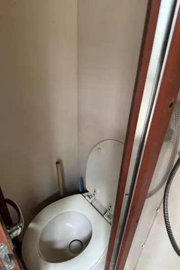  Yacht Photos Pics 2004 Luhrs 36 Convertible boat bathroom with toilet and shower.