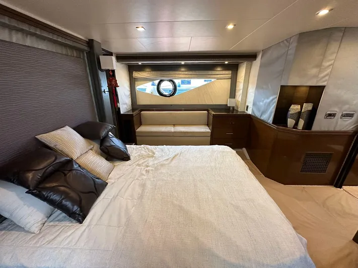  Yacht Photos Pics Luxurious bedroom interior of 2013 Marquis 630 yacht with modern design and elegant furnishings.