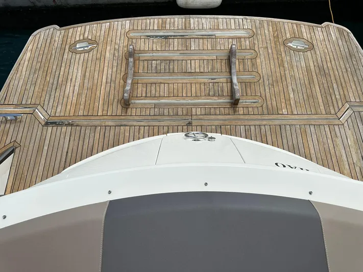  Yacht Photos Pics 2013 Marquis 630 yacht with wooden deck and swim platform.