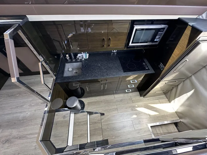  Yacht Photos Pics Luxurious 2013 Marquis 630 yacht kitchen with modern appliances and sleek design.