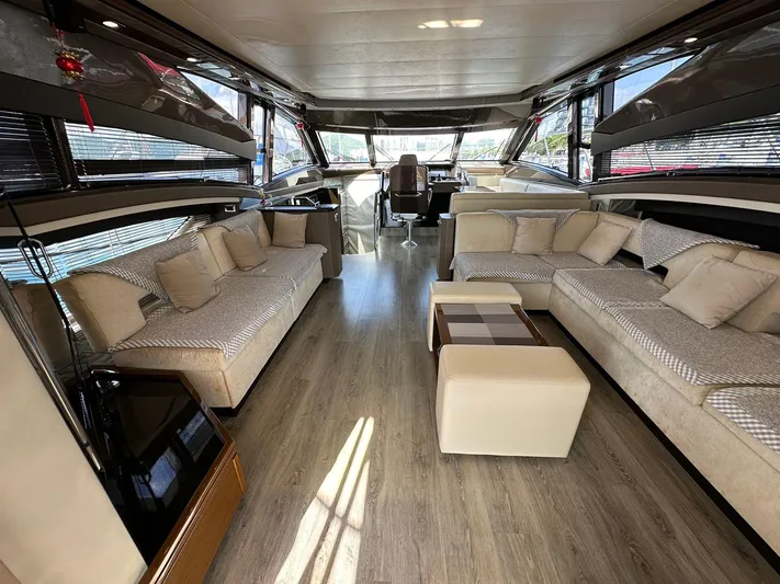  Yacht Photos Pics Luxurious interior of a 2013 Marquis 630 yacht with elegant seating and modern design.