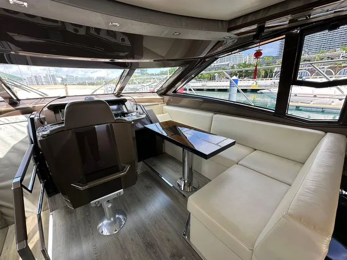  Yacht Photos Pics Luxurious interior of a 2013 Marquis 630 yacht with modern seating and helm.