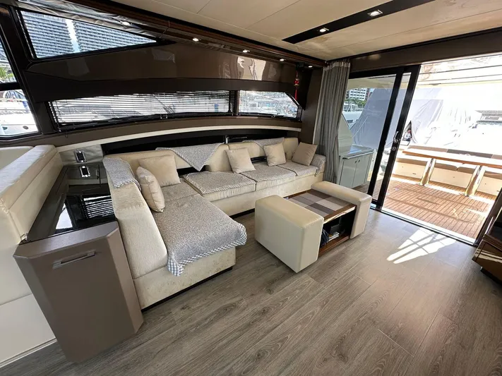  Yacht Photos Pics Luxurious interior of 2013 Marquis 630 yacht with elegant seating and modern design.