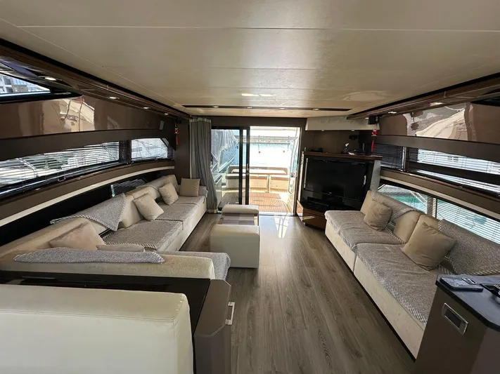  Yacht Photos Pics Luxurious interior of 2013 Marquis 630 yacht with modern furnishings and spacious seating area.