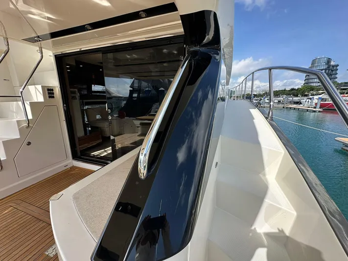 Yacht Photos Pics Luxury Marquis 630 yacht deck with sleek design, docked at marina, 2013 model.