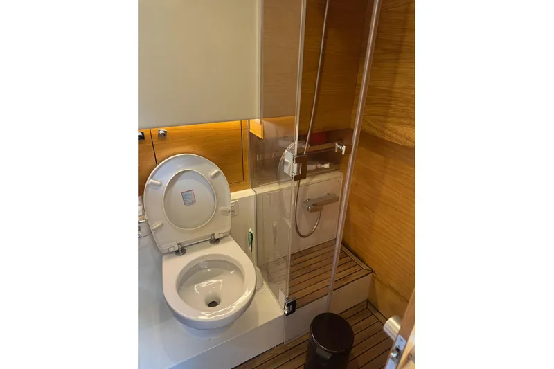  Yacht Photos Pics Luxurious bathroom in 2022 De Antonio Yachts D42 Open, featuring modern fixtures and wooden accents.